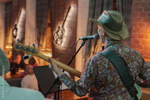 person playing guitar, hand with guitar, jazz band