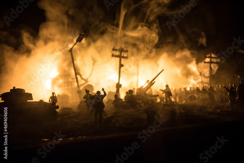 War Concept. Military silhouettes fighting scene on war fog sky background  World War Soldiers Silhouette Below Cloudy Skyline At night. Battle in ruined city. Selective focus