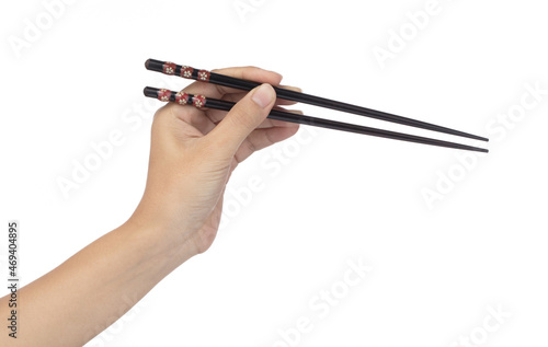 Hand holding Wooden chopsticks isolated on white background