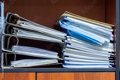 Obraz na płótnie binder folders with documents are sloppy on the shelf of the filing cabinet