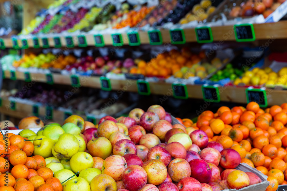 Fresh ripe red apples on the counter in supermarket, nobody