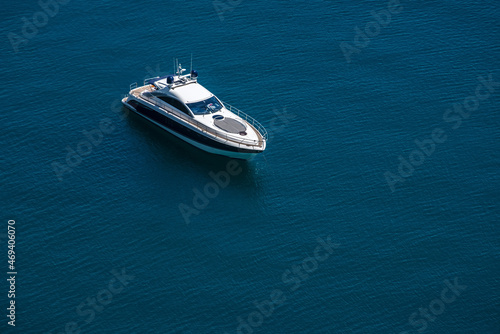 Amazing view to Yacht sailing in open sea at calm day. Drone view - birds eye angle. Yachting theme © Aleksey Dmetsov