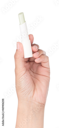 Hand holding Glossy lip balm stick isolated on a white background.