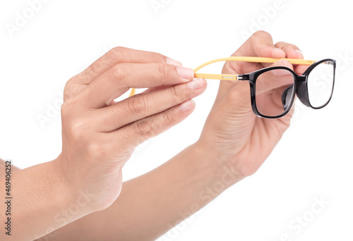 Hand holding Eyeglasses isolated on a white background.