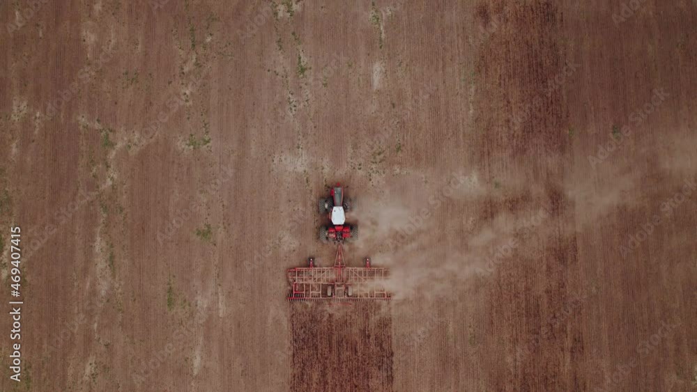 Tillage machine working in the field Tillage machine working in the field