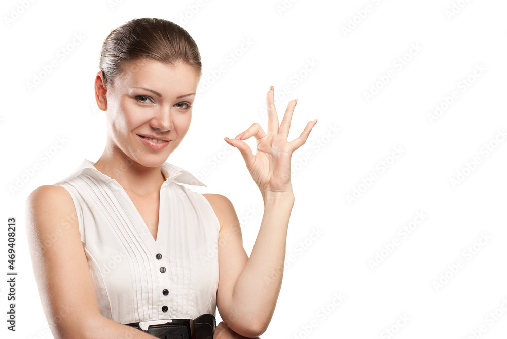 Beautiful young woman signaling ok. Isolated over white background Beautiful young woman signaling ok. Isolated over white background