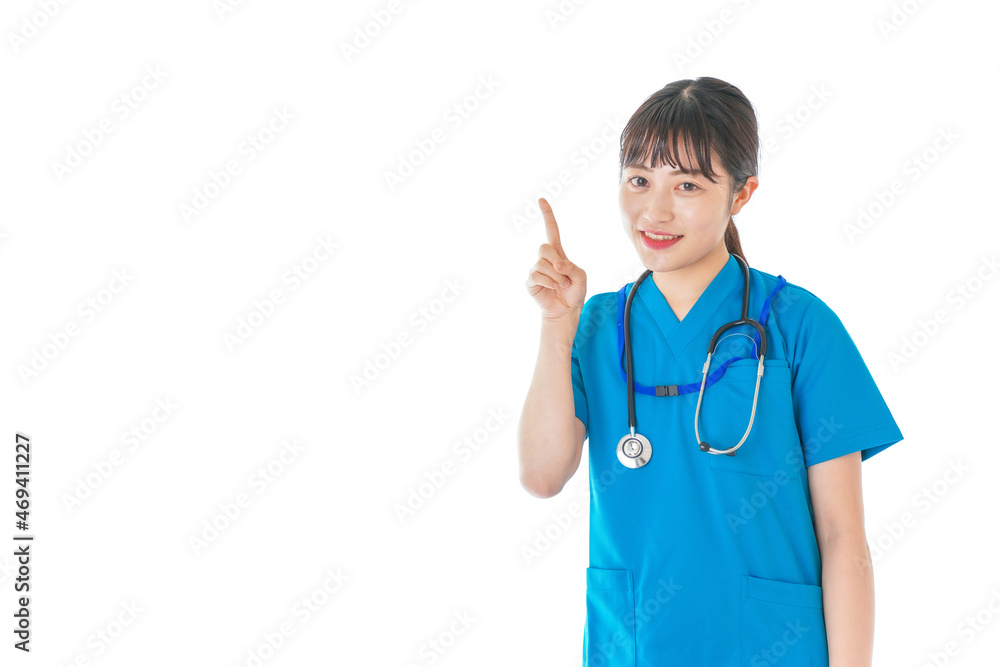 指をさす笑顔の若いナース 指をさす笑顔の若いナース