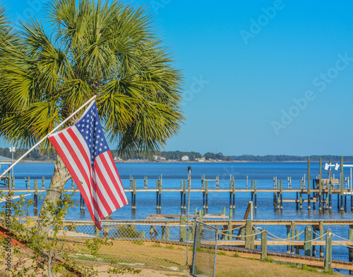 The American Flag along the shoreline of Hammock Bay in Freeport, Walton County, Florida
