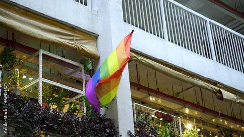 Celebration of Gay Pride in Singapore with rainbow flag hanging outside HDB building in Chinatown , Singapore photo