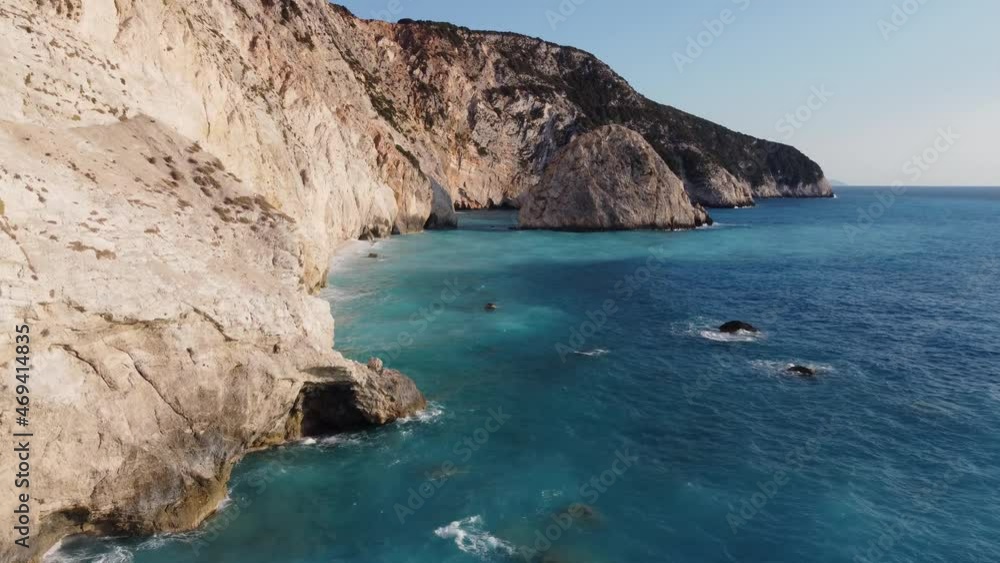 Beautiful and wild rock formations on iconic turquoise waters of Porto Katsiki beach on the coastline of the Aegean sea in Lefkada, Greece Beautiful and wild rock formations on iconic turquoise waters of Porto Katsiki beach on the coastline of the Aegean sea in Lefkada, Greece