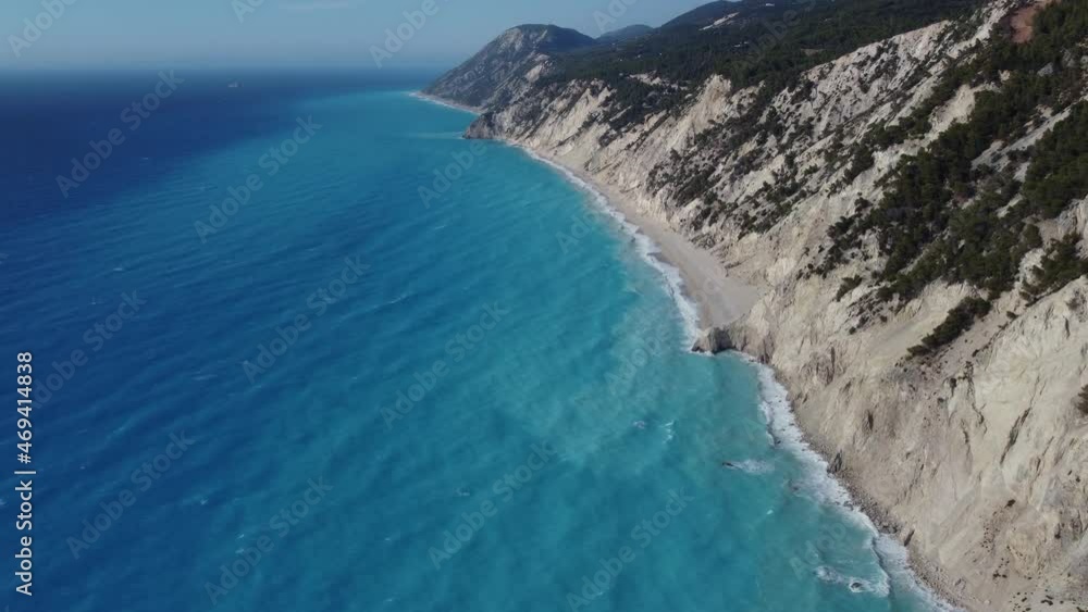 Aerial cinematic shot of the coastline of Lefkada with beautiful turquoise water at Egremni popular beach Aerial cinematic shot of the coastline of Lefkada with beautiful turquoise water at Egremni popular beach