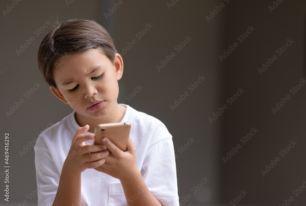 Child looking something on smart phone with intention. Child looking something on smart phone with intention.