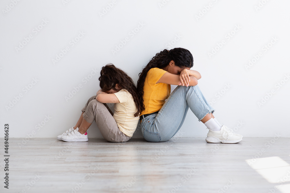 Family Conflicts. Offended Upset Mother And Little Daughter Sitting Back To Back Family Conflicts. Offended Upset Mother And Little Daughter Sitting Back To Back