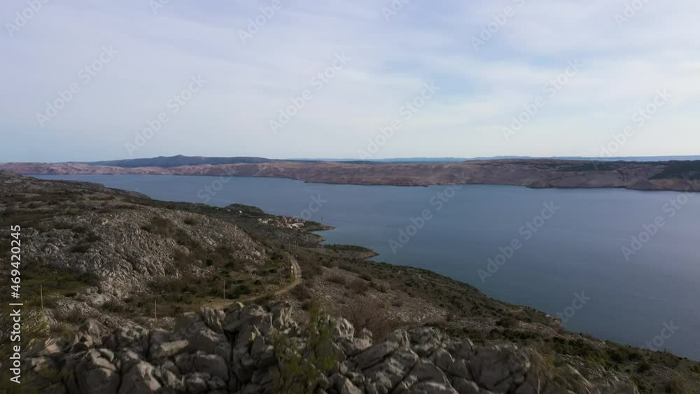 Rocky Mountain At Pag Island With Scenic View Of Adriatic Sea In Croatia. - aerial reveal Rocky Mountain At Pag Island With Scenic View Of Adriatic Sea In Croatia. - aerial reveal
