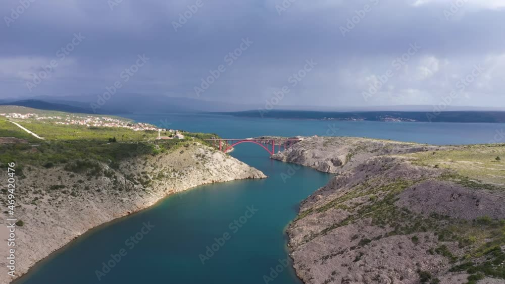 Red Maslenica Bridge Over The Adriatic Sea In Croatia - aerial drone shot Red Maslenica Bridge Over The Adriatic Sea In Croatia - aerial drone shot