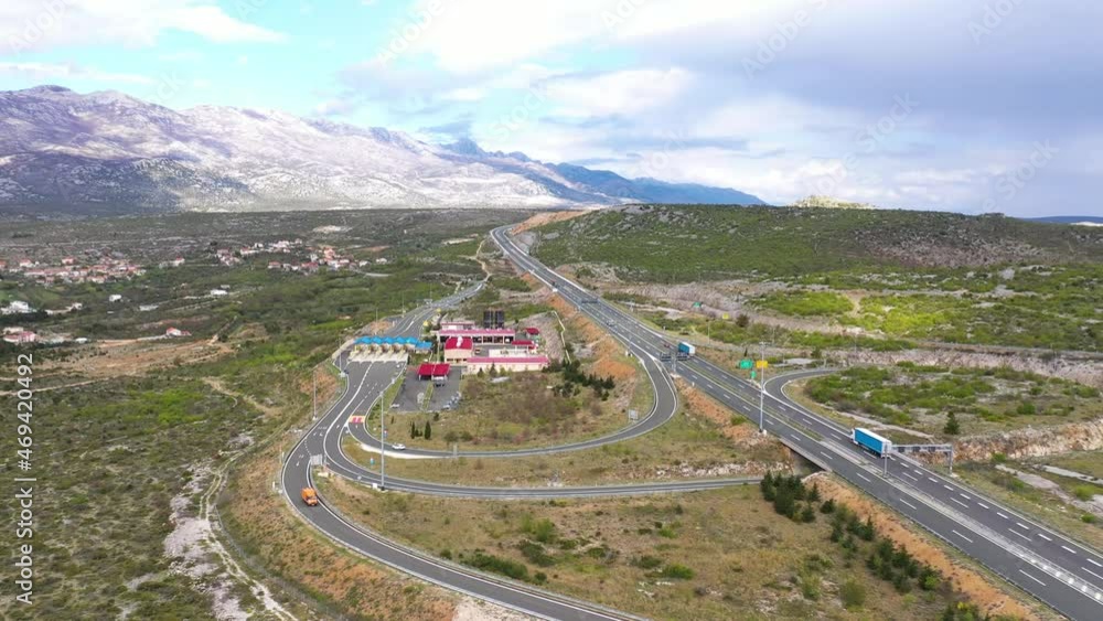 Aerial View Of Vehicles Driving At A1 Motorway With Toll Maslenica In Jasenice, Zadar County, Croatia. Aerial View Of Vehicles Driving At A1 Motorway With Toll Maslenica In Jasenice, Zadar County, Croatia.