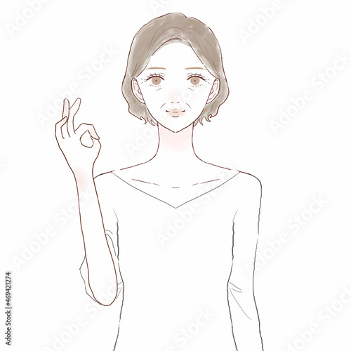 OKサインを出す中年女性