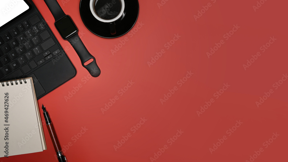 Top view computer laptop, notebook and coffee cup on red background. Top view computer laptop, notebook and coffee cup on red background.