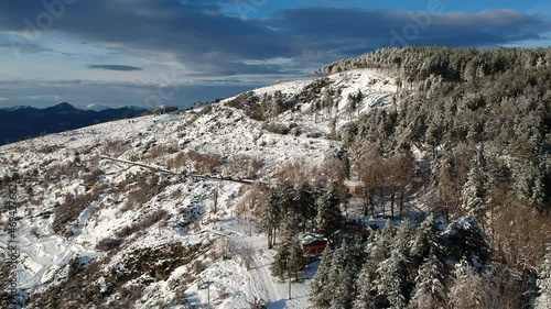 Aerial view of the snowy mountain Taygetus (also known as Taugetus or Taygetos) above Messenia unit in Peloponnese, Greece. Amazing natural scenery of the highest mountain in Peloponnese during winter photo