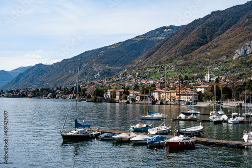 Pier with moored yachts near the town. Lake Como, Italy