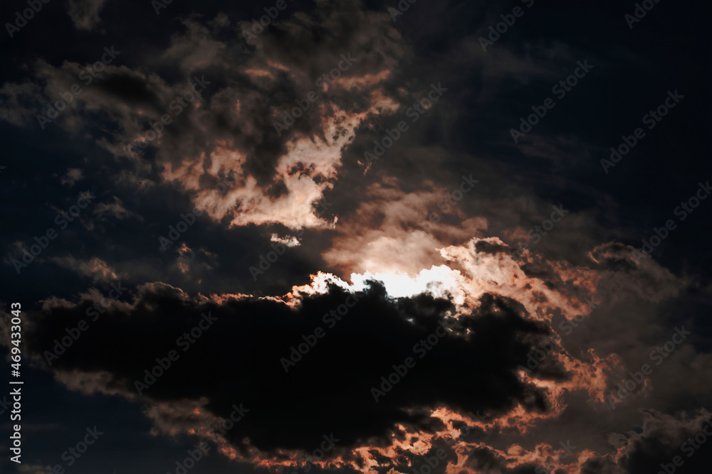 Thunderclouds at dusk at sunset. Shooting against the light. Selective focus. Thunderclouds at dusk at sunset. Shooting against the light. Selective focus.