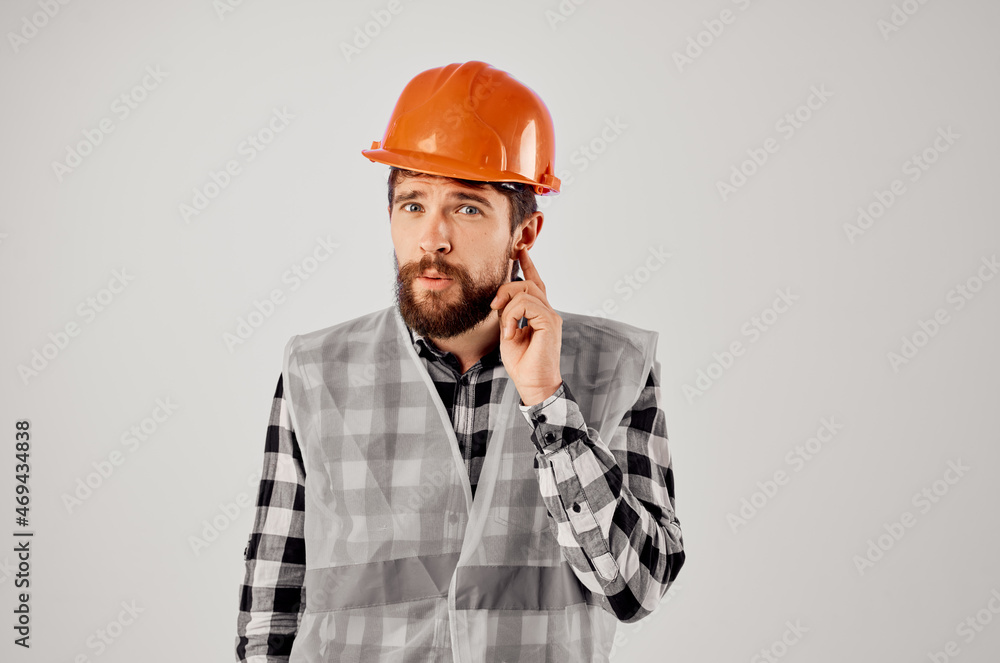 male worker orange helmet blueprints Professional light background