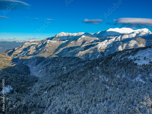 Aerial view of the snowy mountain Taygetus (also known as Taugetus or Taygetos) above Messenia unit in Peloponnese, Greece. Amazing natural scenery of the highest mountain in Peloponnese during winter photo