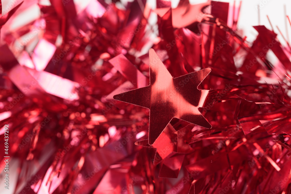 Red Christmas tinsel with stars. Red Christmas tinsel with stars.