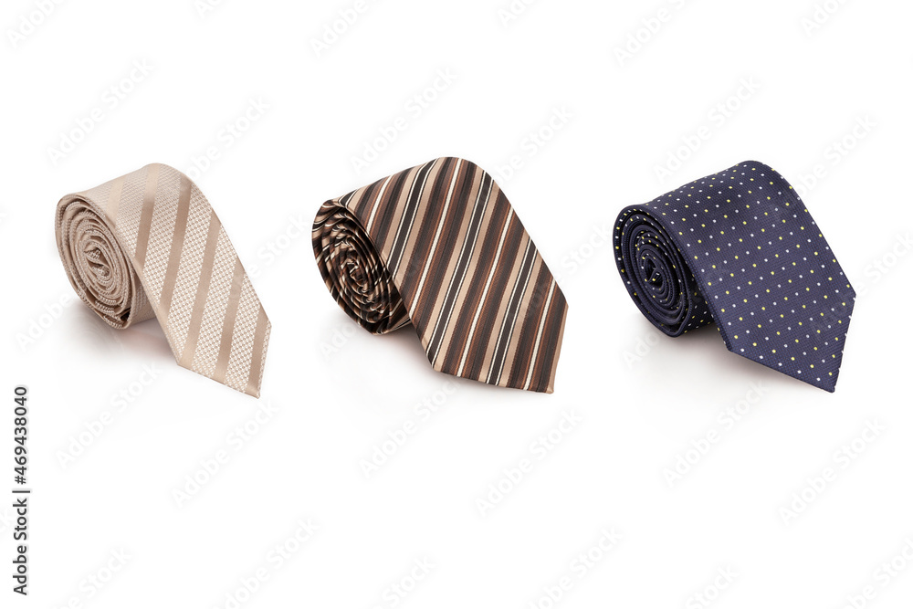 Set of men's ties of different colors on a white isolated background. Tie for a suit. Set of men's ties of different colors on a white isolated background. Tie for a suit.
