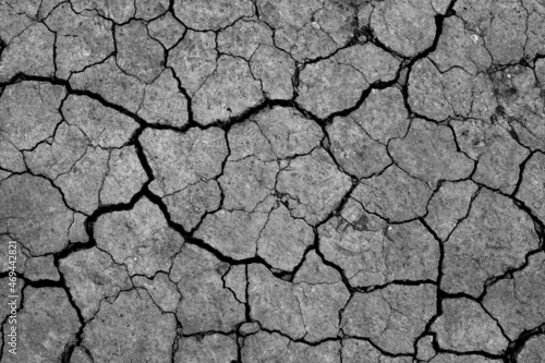 Dry cracked earth, parched land, Earth dirt texture background of brown mud, arid soil, Dry cracked earth texture. 