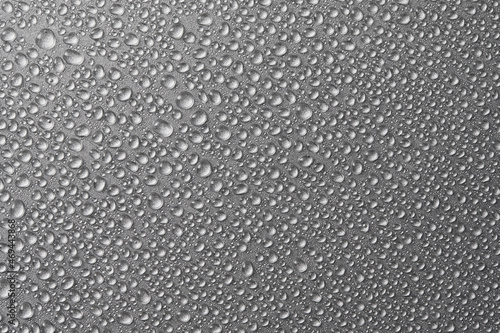 Water drops on dark silver background