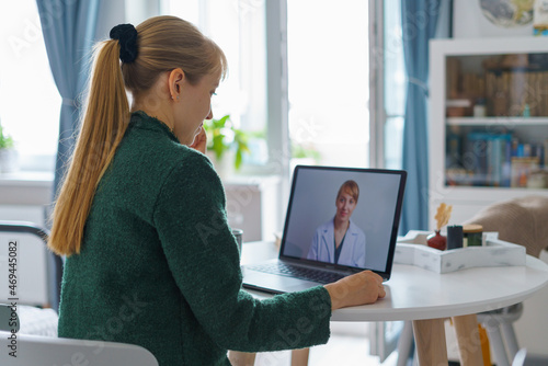 Woman videocalling doctor online from home. Telemedicine and future teleconsulting photo