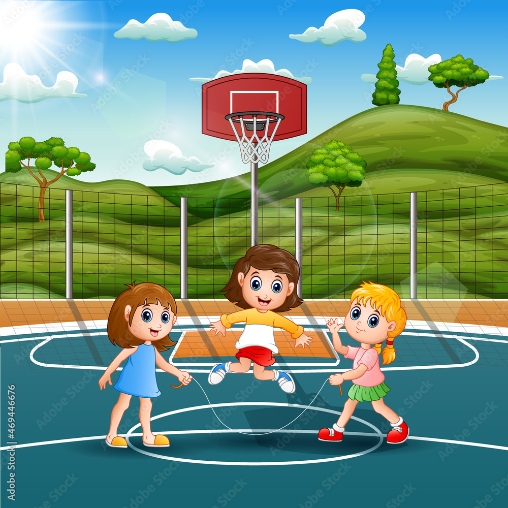 Fototapeta premium Three girls playing jump rope in the field