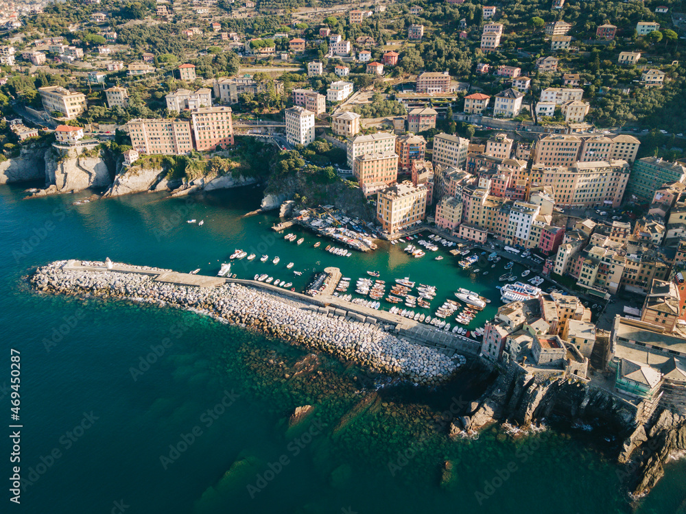 Naklejka premium Italian riviera from above - liguria coast, Camogli city fishing boat harbor and ancient old town. Italy.