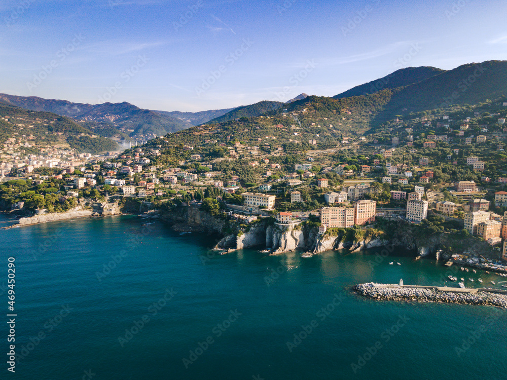Aerial view of Italian coastline. Genova area, Camogli city. City next to the big cliffs. Mediterranean sea in liguria coast. 