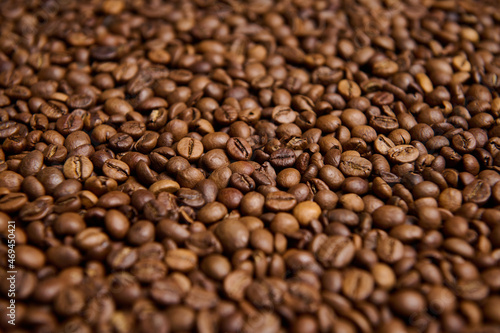 Close-up composition of fresh roasted coffee beans. Coffee grains background. Food background. Copy space