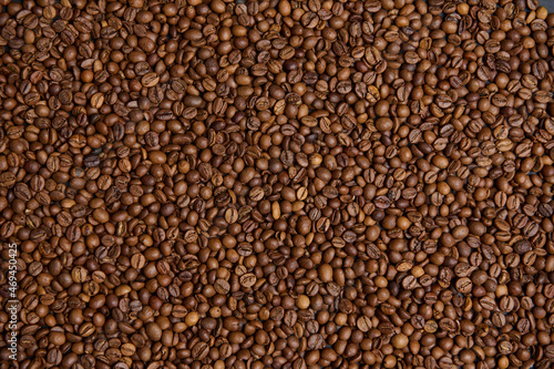 Flat lay composition of fresh roasted coffee beans. Coffee grains background. Food background. Copy space
