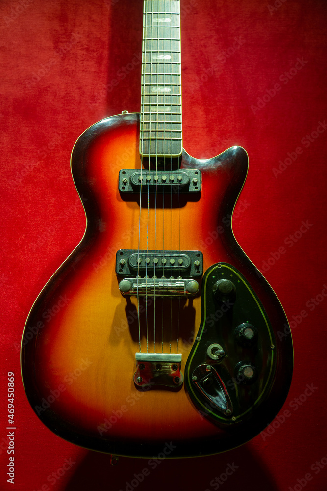 old electric guitar. wooden electric guitar. brown electric guitar