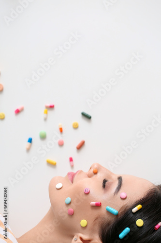 Beautiful woman with pills ...