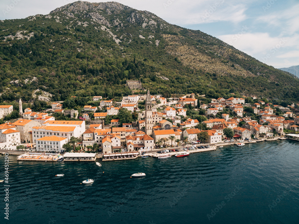 Berth with boats in Perast on the shore of the Kotor Bay. Montenegro