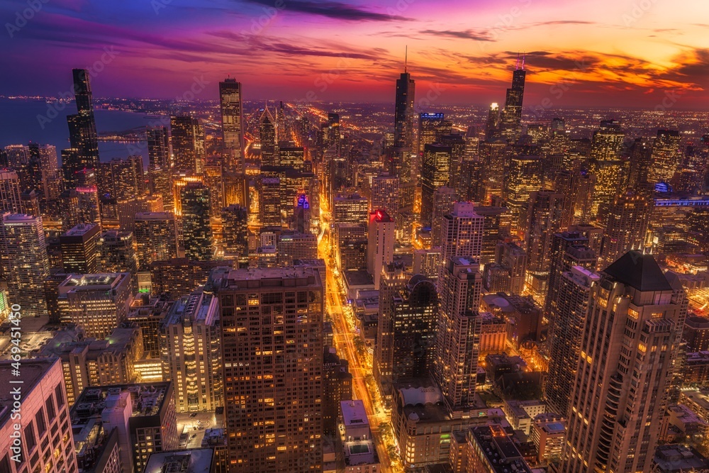 This aerial image captures the beauty of Chicago's downtown city skyline at sunset.