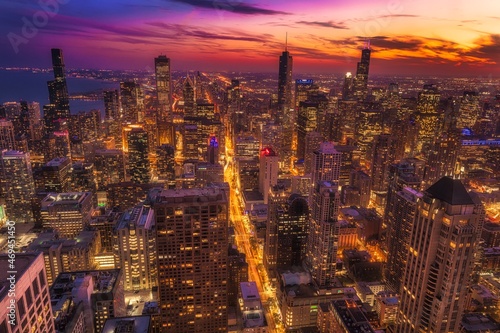 This aerial image captures the beauty of Chicago's downtown city skyline at sunset.