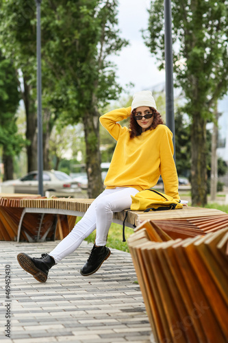 Young woman in beanie hat a...
