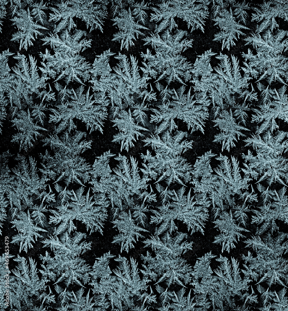 Frostwork pattern ice crystals on black background. Dark surface with ...