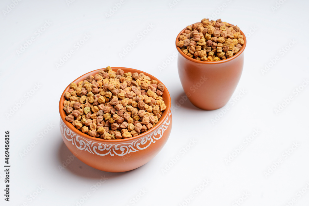 Dry chickpea in bowl on white background. Dry chickpea in bowl on white background.