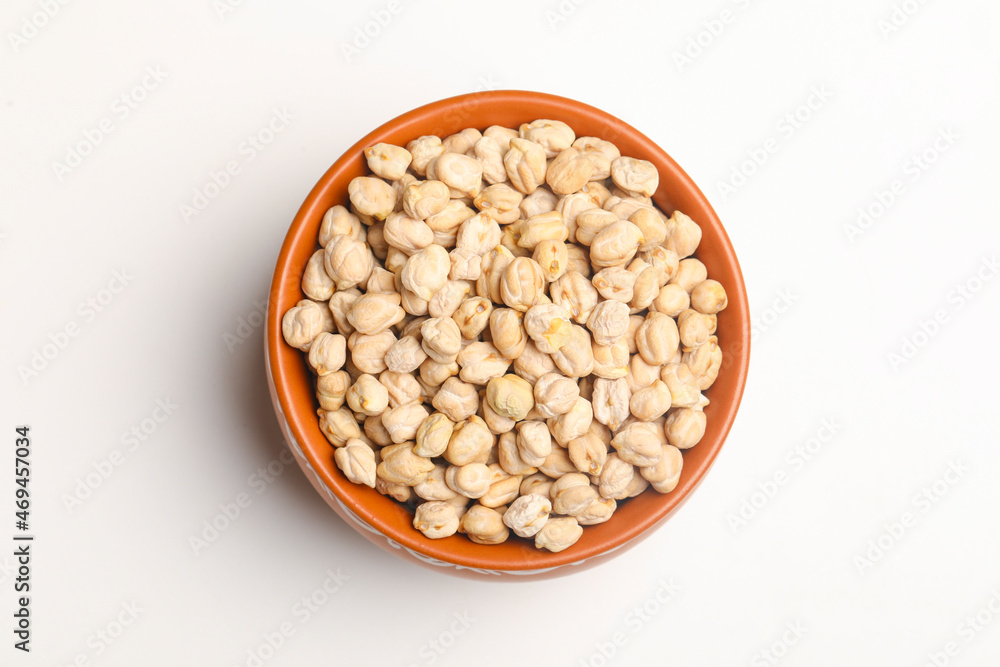 Dry chickpea in bowl on white background. Dry chickpea in bowl on white background.