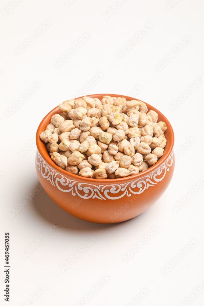 Dry chickpea in bowl on white background. Dry chickpea in bowl on white background.