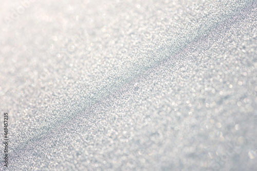 White frost with frozen snowflakes, natural blurred background with copy space for your design, abstract texture