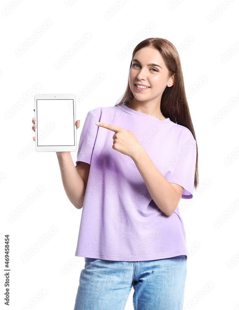 Pretty young woman pointing at tablet computer on white background Pretty young woman pointing at tablet computer on white background
