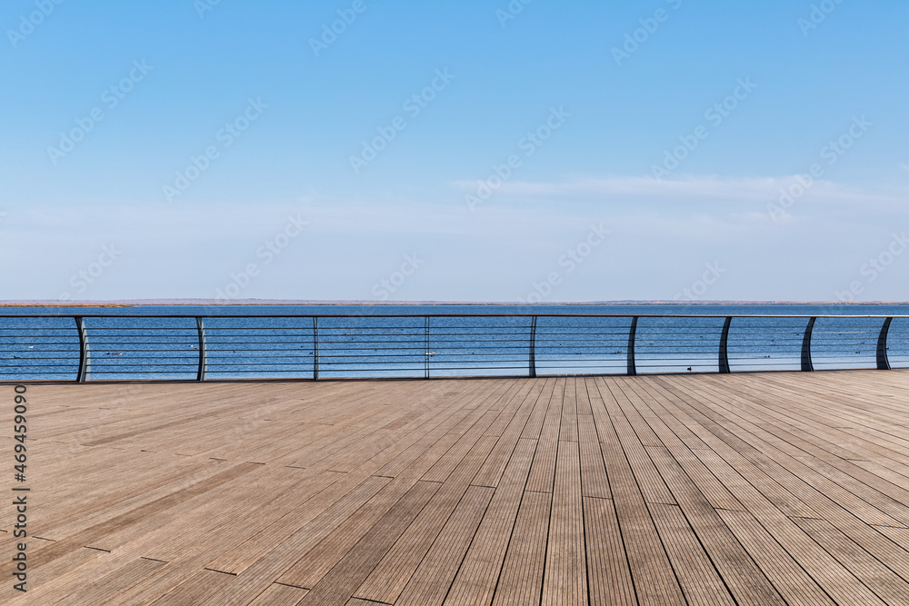 lake view and wooden floor with railing